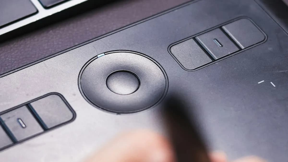 Designer's hand with a stylus working on a graphics drawing tablet for AI-assisted design