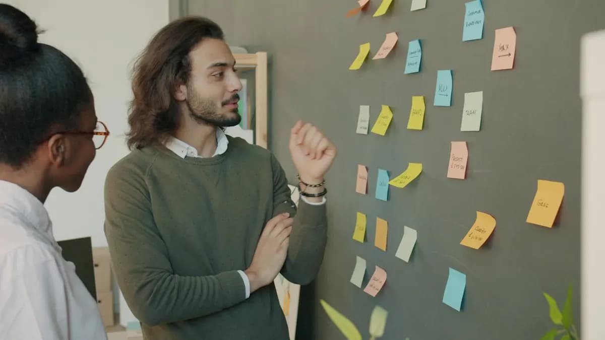 Two people planning an explainer video storyboard with sticky notes on a wall