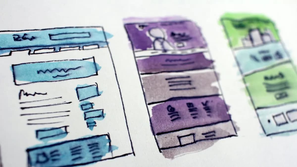 Hand-drawn watercolour wireframe sketches of three website page layouts
