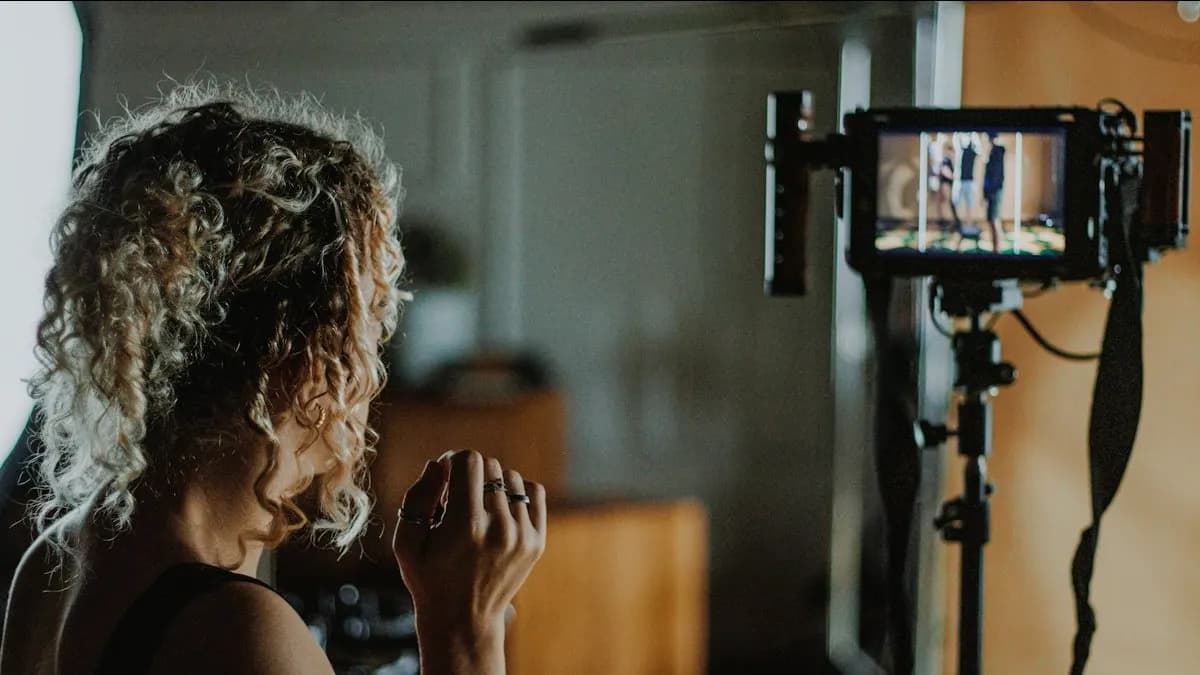 Video maker checking a shot on a camera monitor during a professional video shoot