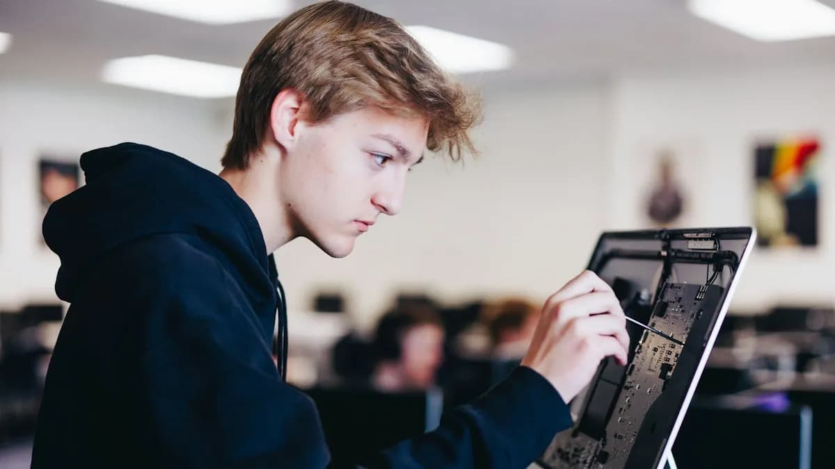 A trainer guiding a single student at a computer