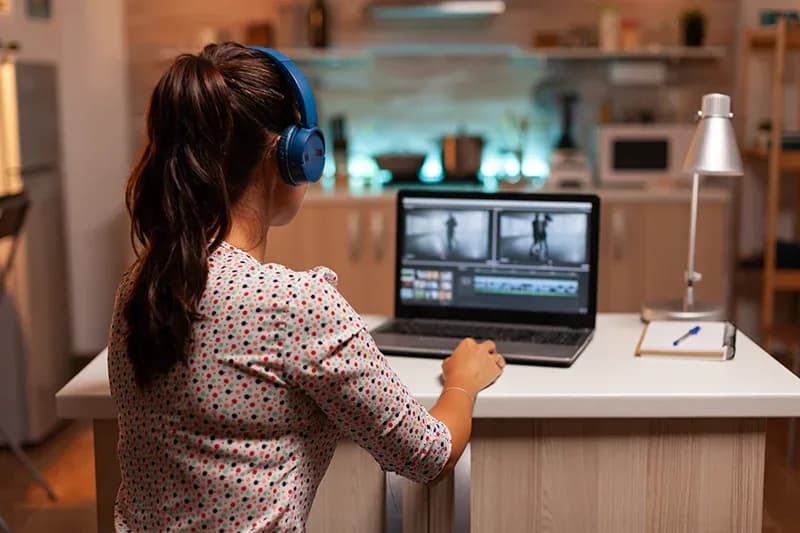 Video editing workstation with timeline and colour grading tools on screen