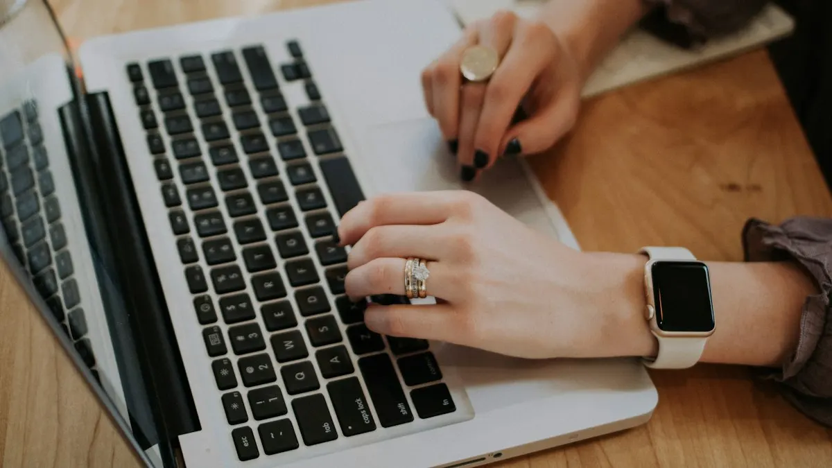 Learner typing notes on a laptop during an online digital marketing class