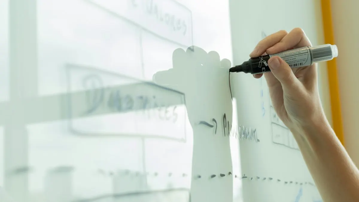 Hand drawing a rough storyboard diagram on a whiteboard for an animated explainer