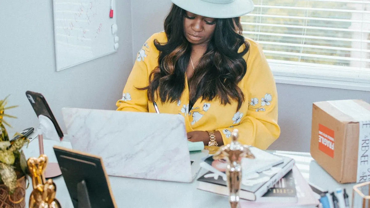 Woman freelancing from her home office on a laptop surrounded by work notes