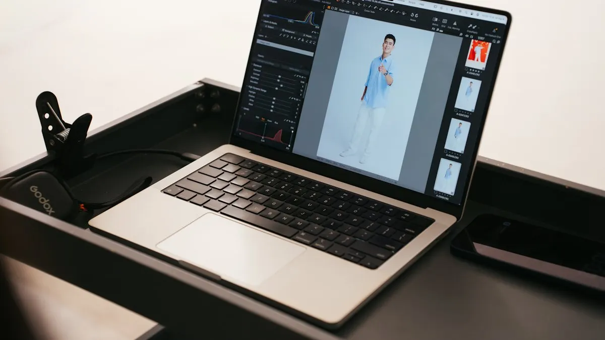 Laptop on a camera desk showing a fashion photo open in photo editing software