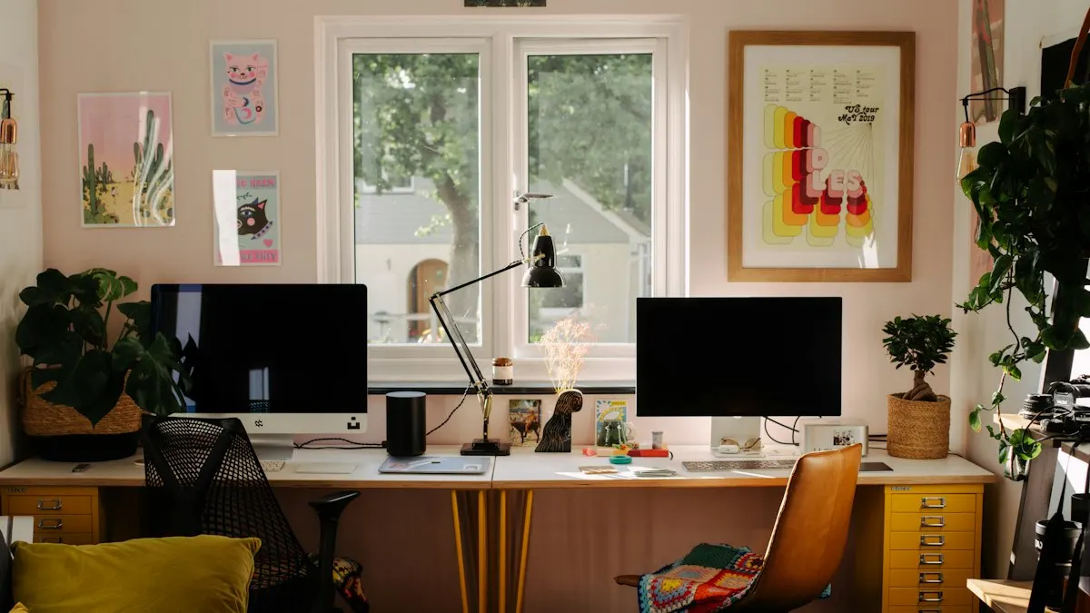 Bright home studio with two computer monitors on a long desk, set up for design and video editing work