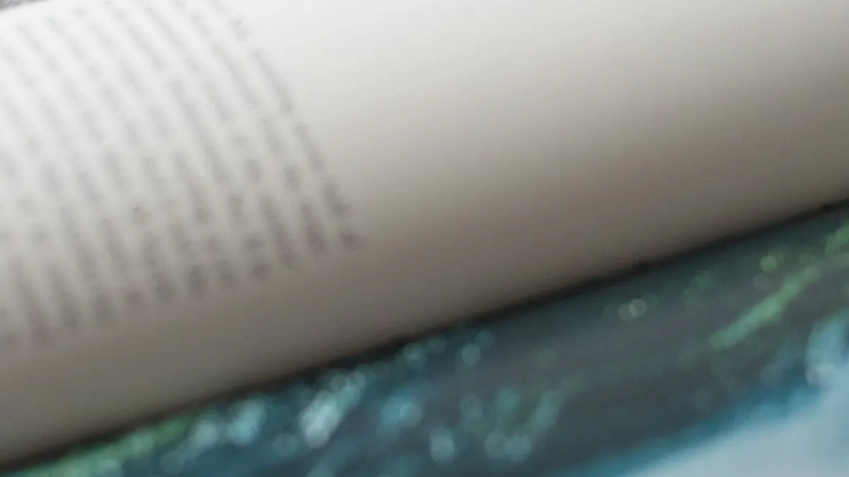 Close view of a printed book page with columns of text laid out for print