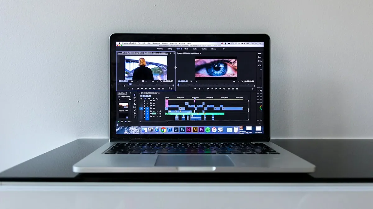 Close view of a laptop keyboard and screen on a work desk