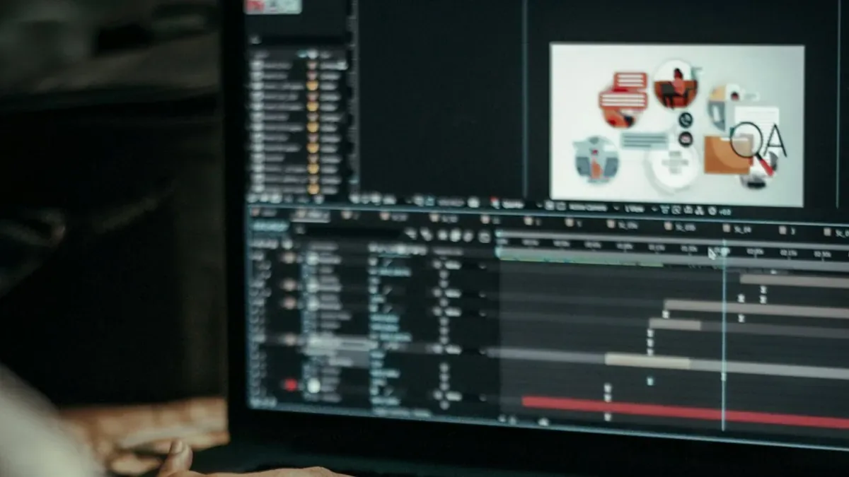A motion designer working on animation software across two monitors