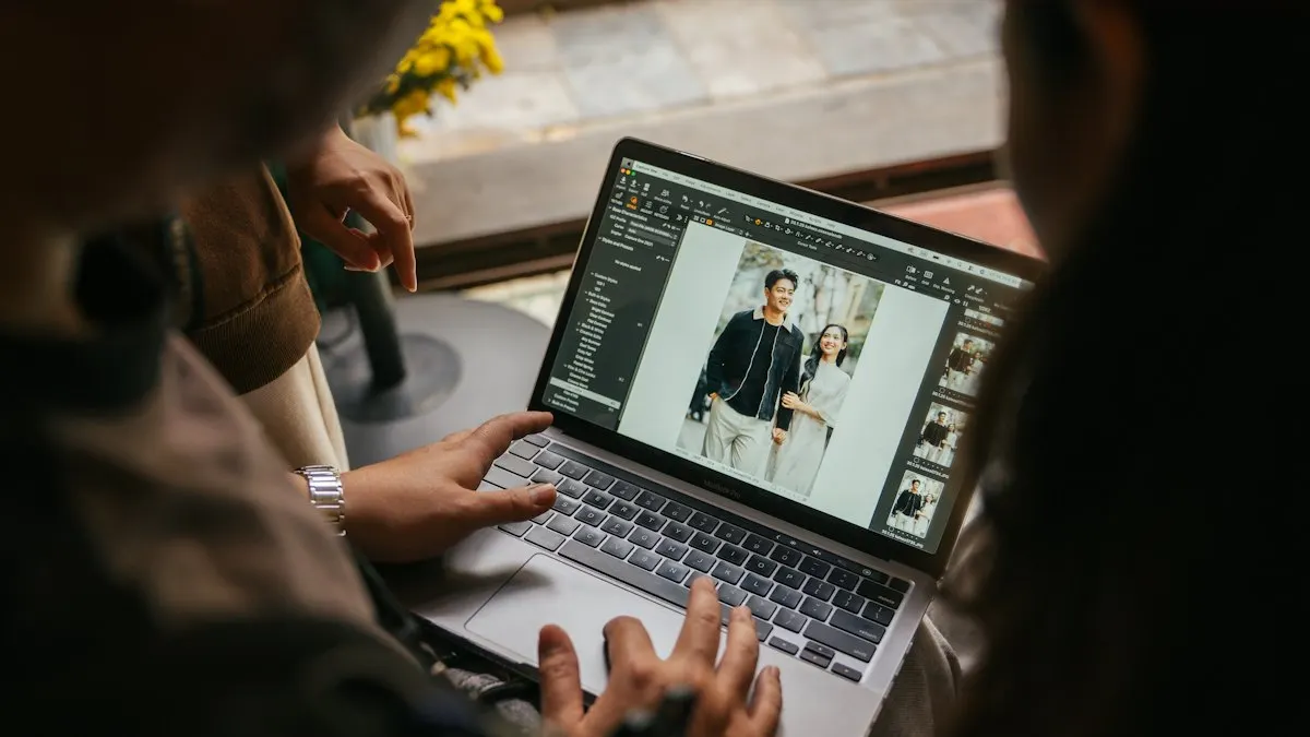 Two people reviewing an edited photo on a laptop screen before sending it to a client