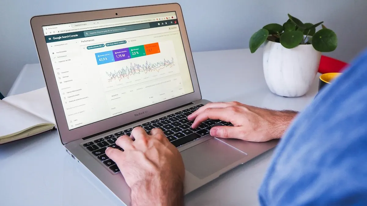 Person checking a website traffic dashboard on a laptop while learning Search Console