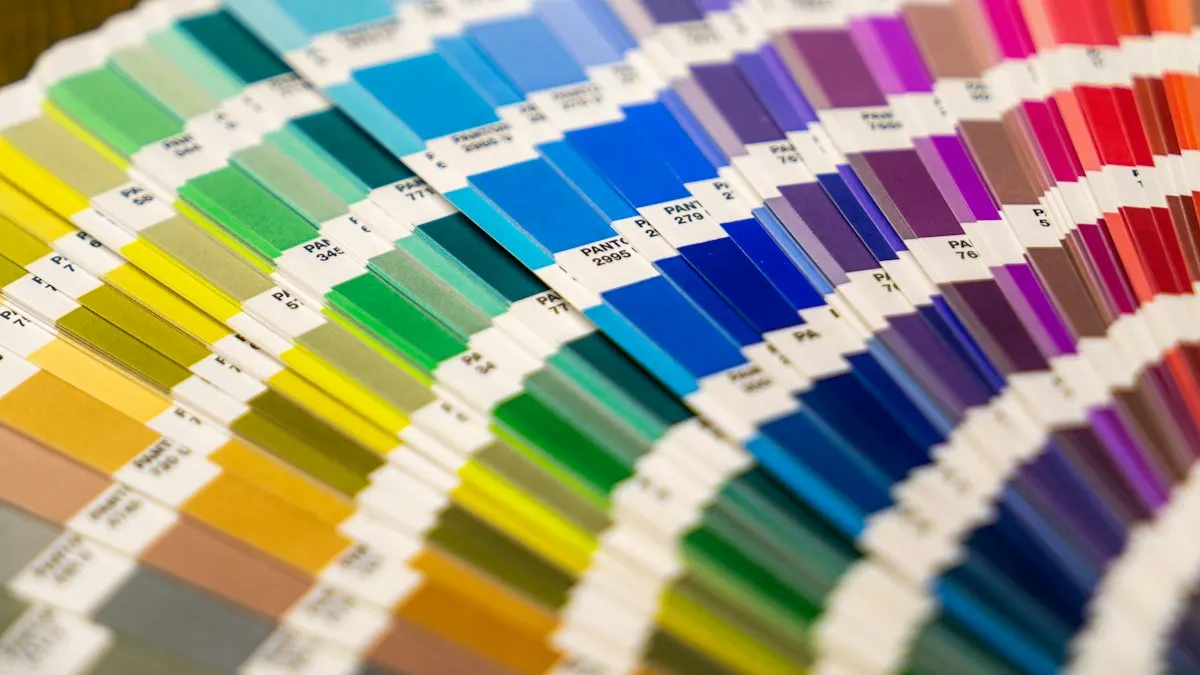 Fan deck of printed colour swatches arranged in a rainbow spectrum used by graphic designers
