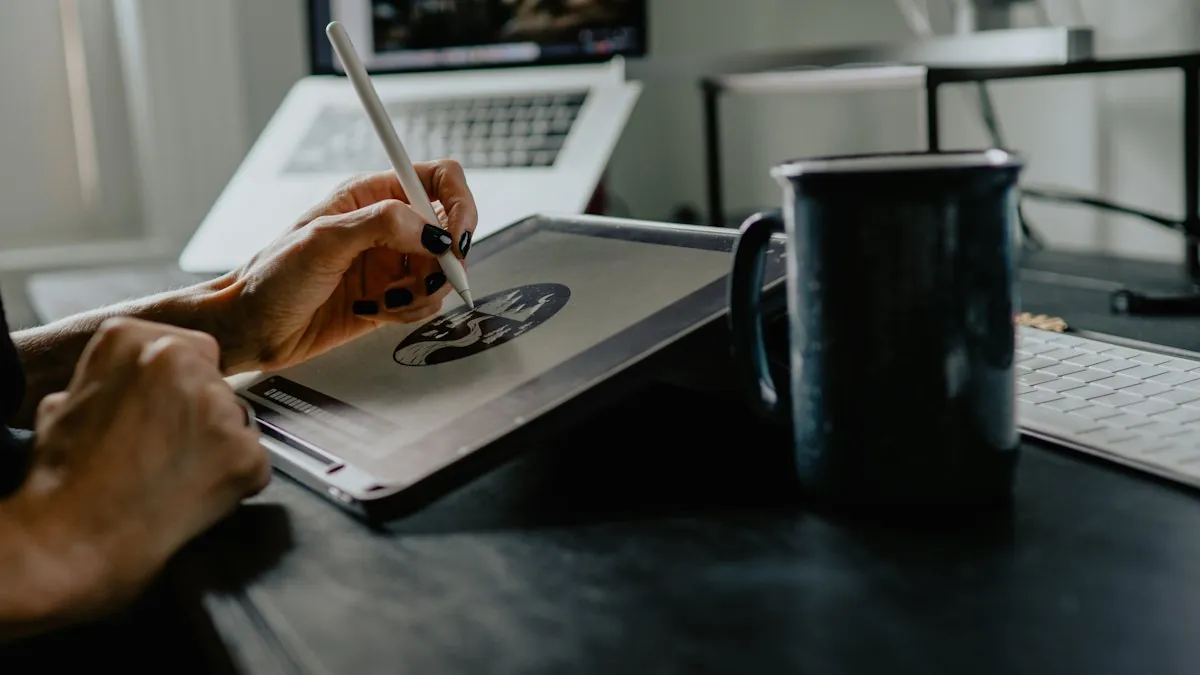 A designer drawing a logo on a tablet with a stylus at a desk